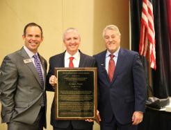 Dr. Thacker receiving his award from IAPSS