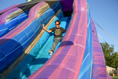 Person on a bounce house slide.