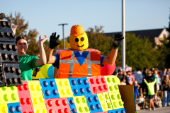 Two people in colorful costumes posing for a picture.