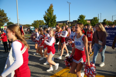 Cheerleaders performing at a parade.