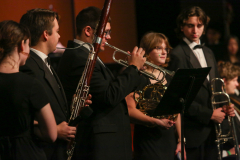 Musicians on stage performing in a band.