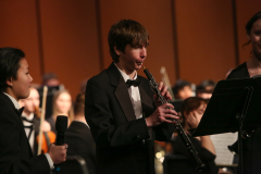Three musicians performing on stage.