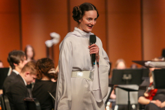 Woman in a Star Wars costume on stage at an event.