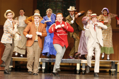 Theatrical performance of "Music Man" on stage.
