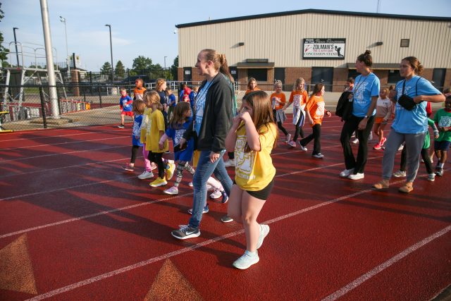Students walk around the track for walk a thon