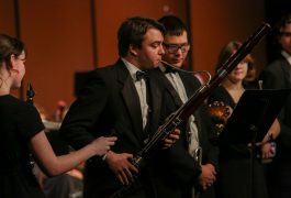 student plays oboe