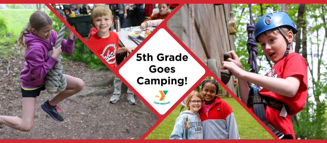 Children at a camping event, posing for a group photo in front of a sign that reads "6th Grade Goes Camping!