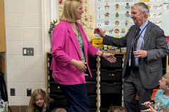 Man and woman standing in front of a classroom.