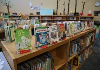 Dr. Seuss books on a shelf in a library.