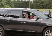 Woman in a car on her first day of kindergarten.