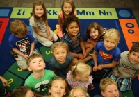 Children in a classroom on the first day of kindergarten.
