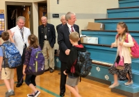 Dr. Thacker welcomes back Madison students with Board Members Jim Garrett & Larry Beehler